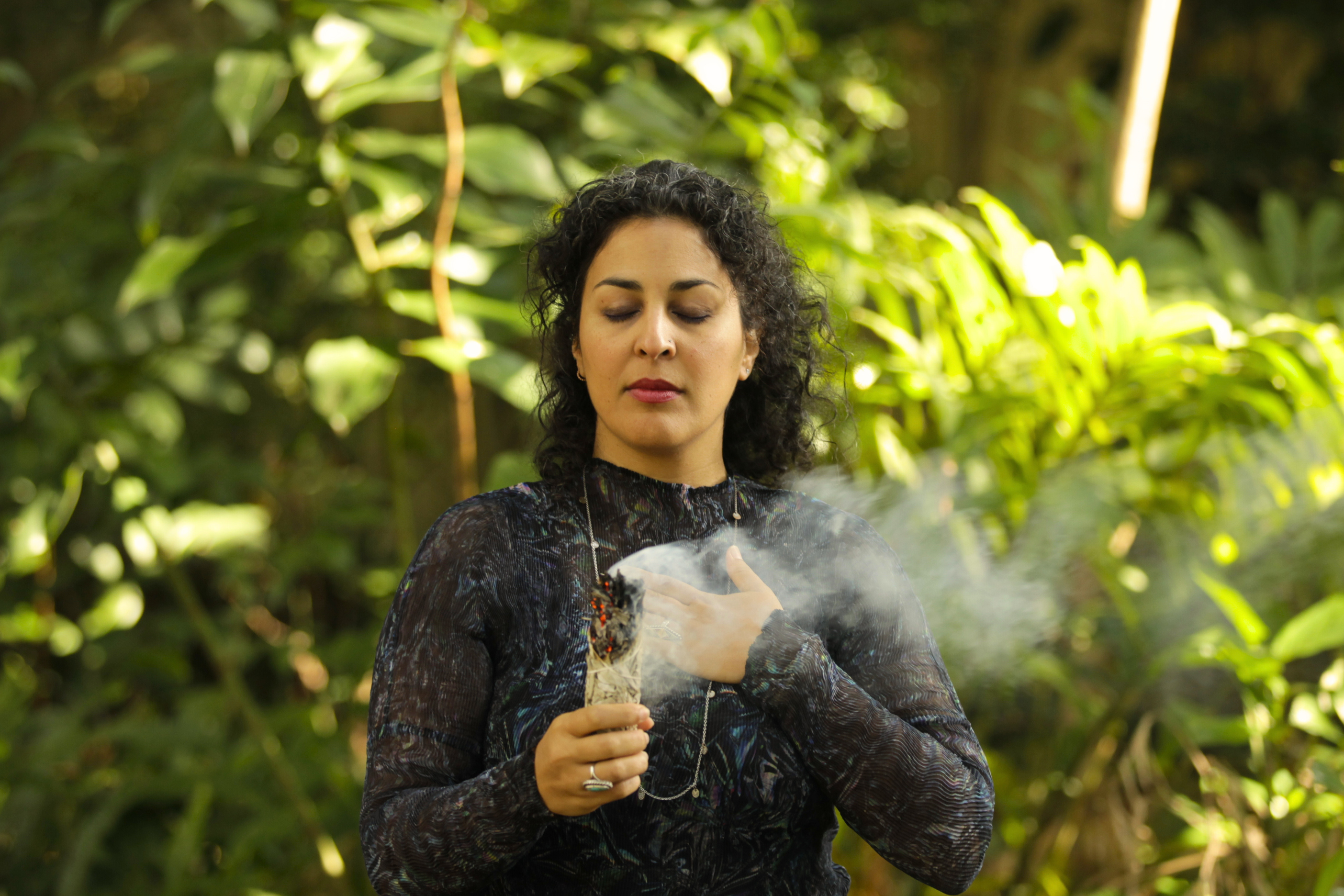 Woman standing in nature with sage