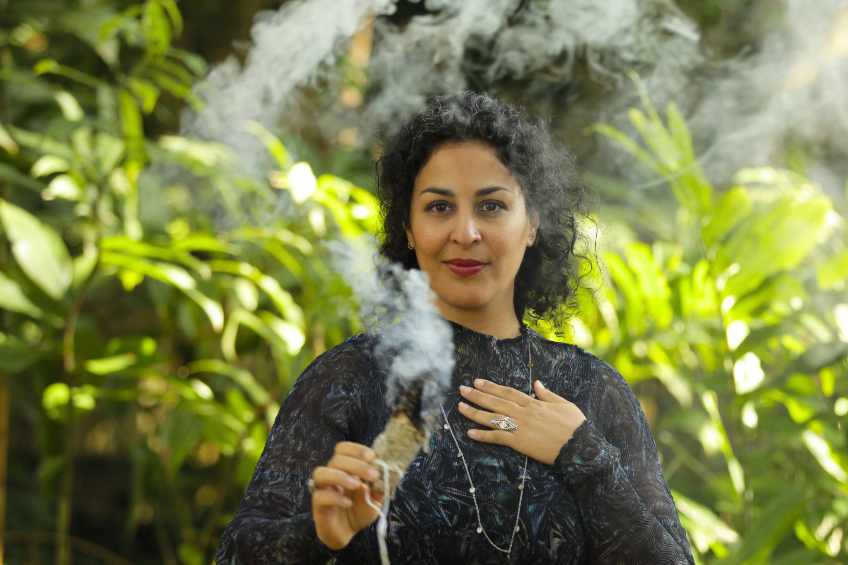 Woman standing in nature with sage