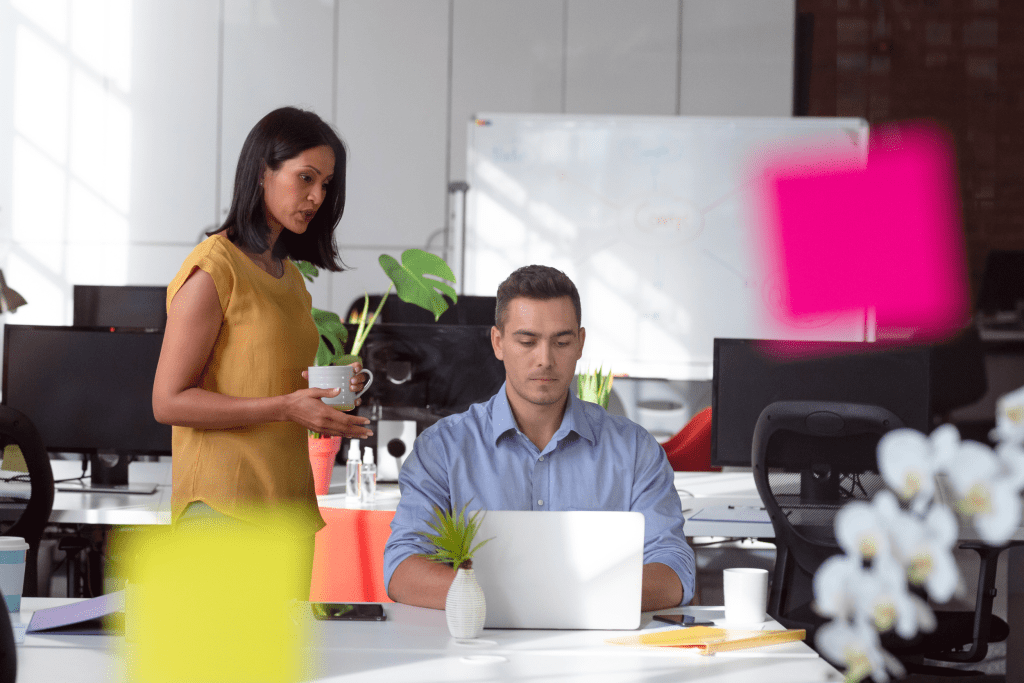 Two colleagues working in the offices